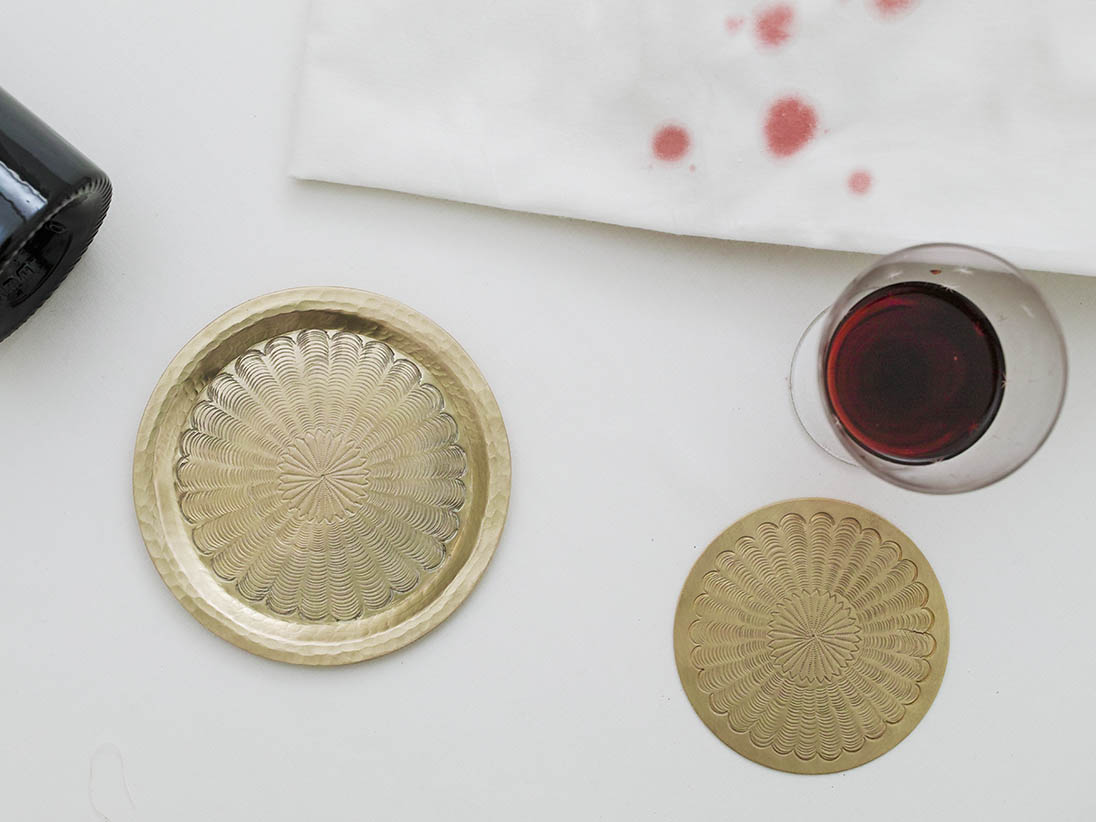 Chiseled brass coaster and wine plate